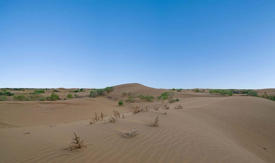 China breaks ground on massive desert solar and wind power base.