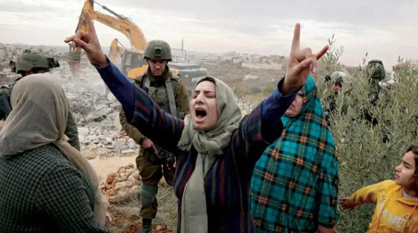 Israeli settlers assault Palestinians in the southern West Bank town of Tarqumia